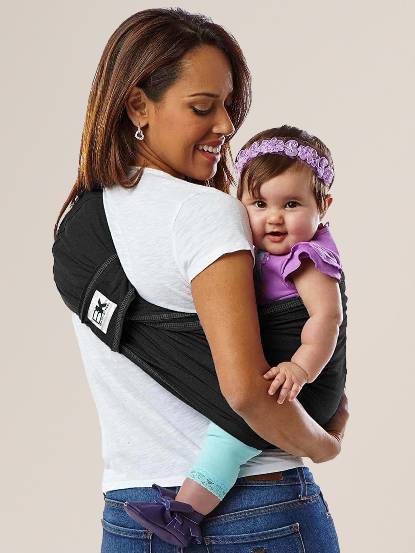 Model wearing baby in the Baby K'tan Original Baby Carrier in Black