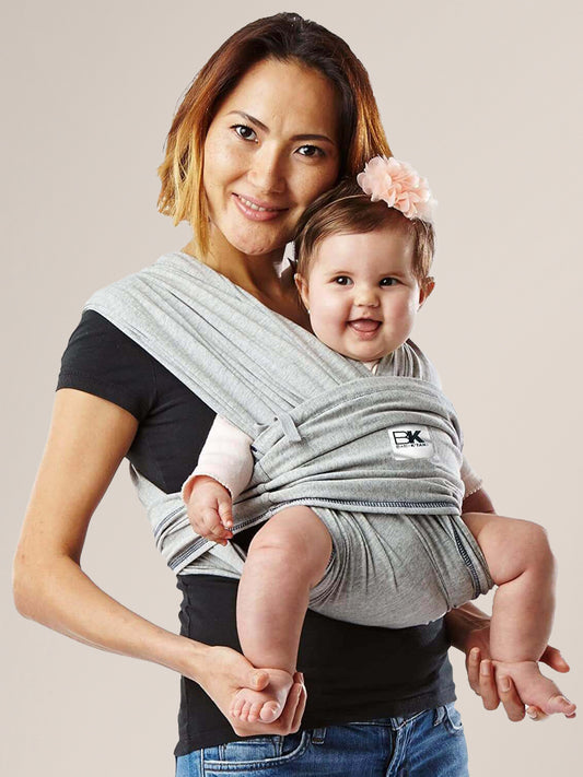 Model wearing baby in the Baby K'tan Original Baby Carrier in Heather Grey